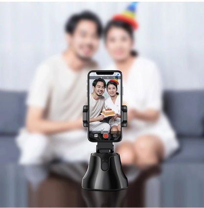 Smartphone with a selfie stick displaying a photo of two people, with text about intelligent shooting modes.